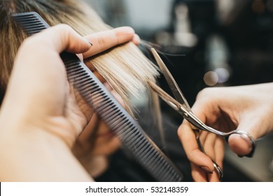Scissors cut the girls hair - Shutterstock ID 532148359