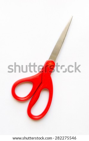Scissors cut paper red handle on a white background.