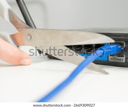 Scissors cut the router cables. 