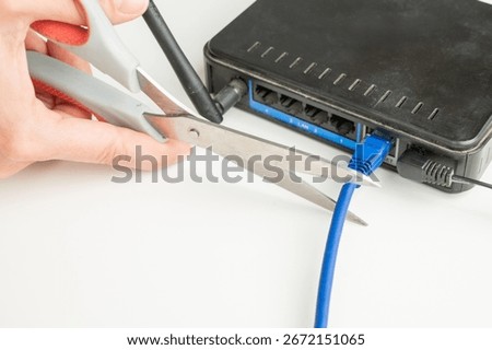 Scissors cut the router cables. 