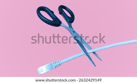 Scissors cutting a network cable on a pink background, symbolizing internet disconnection, digital detox, or cybersecurity awareness.