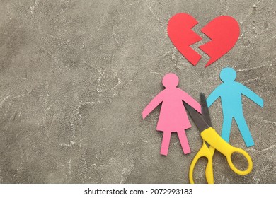 Scissors Cutting Paper Cut Of Family On Pink Background. Broken Family Concept, Divorce. Top View