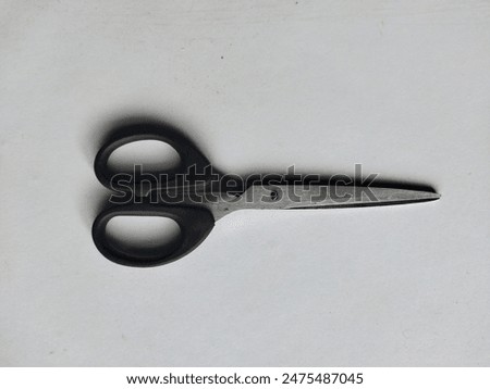 Scissors are a cutting tool with two-sided sharpness that is used by hand. Cutting with scissors occurs due to adjacent pressure on the object being cut.