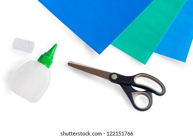 Scissors, Glue And Paper On A White Background