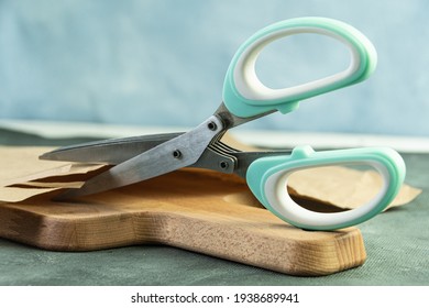 Scissors With Green Handles Cut Wrapping Paper. Tool For Cutting Vegetables And Fresh Herbs. It Has Several Sharp Blades For Fine Chopping