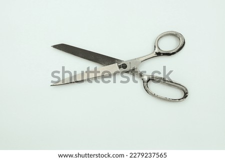 Scissors isolated white background, single used old scissors, in open position