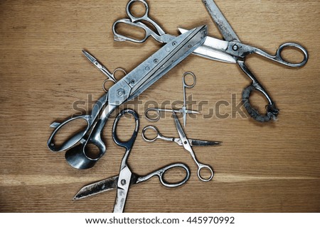 Scissors on a wooden background