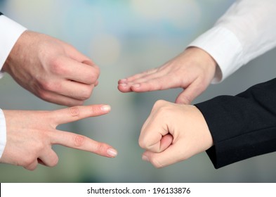 Scissors, Paper, Stone, Scissors - Hands  On Light Background