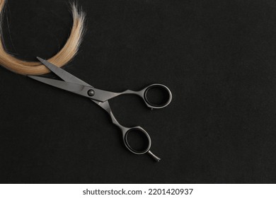 Scissors And Piece Of Blond Hair. Professional Barber Hair Cutting Shears On Background. Hairdresser Salon Equipment Concept, Premium Hairdressing Set. Accessories For Haircut With Copy Space