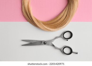 Scissors And Piece Of Blond Hair. Professional Barber Hair Cutting Shears On Background. Hairdresser Salon Equipment Concept, Premium Hairdressing Set. Accessories For Haircut With Copy Space