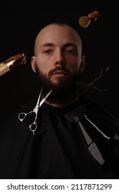 Scissors, razor and hair dryer cut man's hair and beard - Shutterstock ID 2117871299