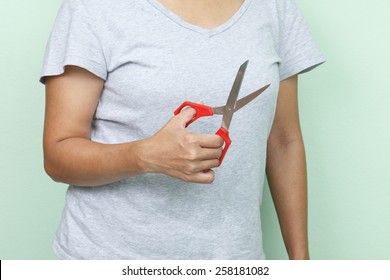 scissors in woman's hand