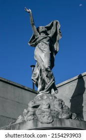 Sclupture Of Cementery And Blue Sky