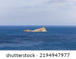 Scoglietto Lighthouse is an active lighthouse located on the summit of a rocky islet without vegetation in front of Portoferraio in the Piombino Channel. Island of Elba, Italy