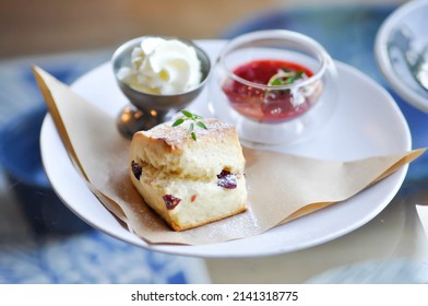 scone , cranberry scone or scone with whipped cream and strawberry dip