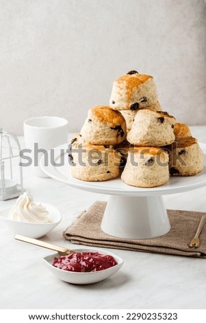 Scone Stacked on top of each other, on white dessert trays, with Space For your Text or Graphics Design.