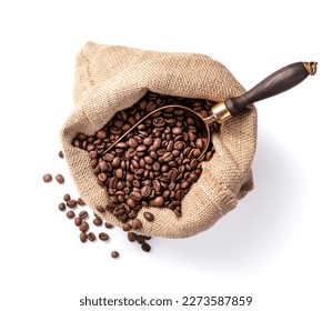 Scoop of coffee beans in a bag on white background. Coffee in scoop isolated. Top view of coffee.