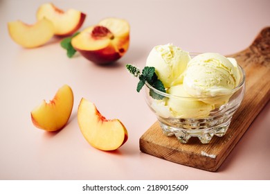 Scoop Of Peach Ice Cream In A Glass.