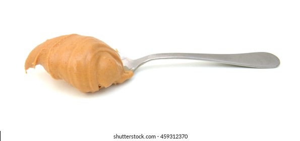 Scoop Of Peanut Butter On A Metal Spoon Isolated On White.