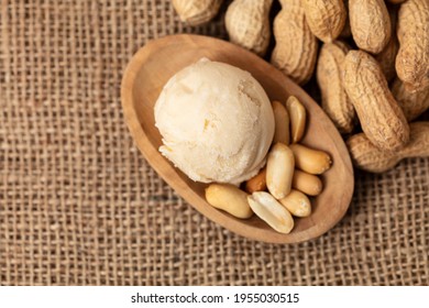 Scoop Of Peanut Ice Cream Or Peanut Butter Ice Cream From Above With Peanuts For Decoration