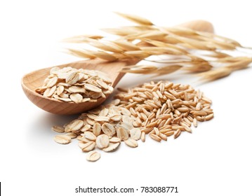 scoop and pile of oatmeal with its unprocessed grains and plant