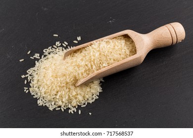 Scoop of rice on puffed rice cereal background close up - Shutterstock ID 717568537