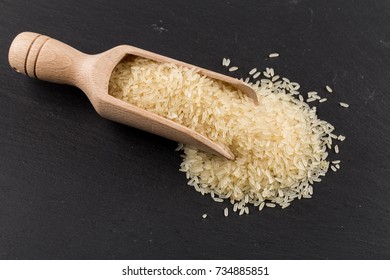 Scoop of rice on puffed rice cereal background close up - Shutterstock ID 734885851