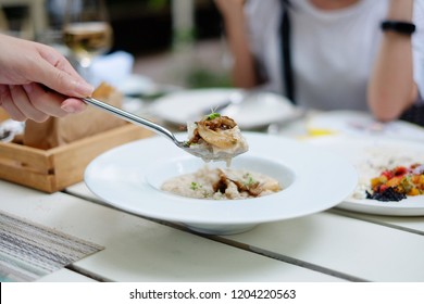 Scoop risotto truffle mushroom on white plate recipe 