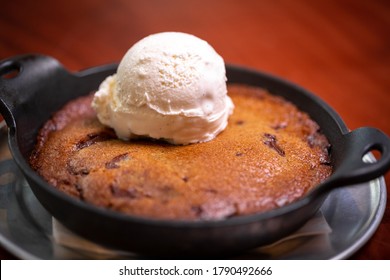 Scoop Of Vanilla Ice Cream On A Chocolate Chip Cookie Pie, In A Cast Iron Dish