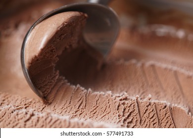 scooping chocolate ice cream close up shot, shallow focus - Shutterstock ID 577491733