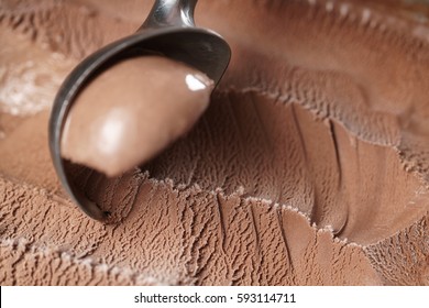 scooping chocolate ice cream close up shot, shallow focus