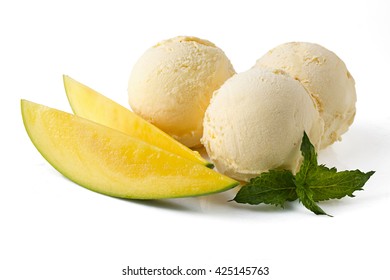 Scoops Of Mango Ice Cream With Slice Of Mango And Mint Sprig On White Background. Mango Sorbet. Isolated