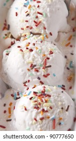 Scoops Of Vanilla Ice Cream In Bowl With Sprinkles