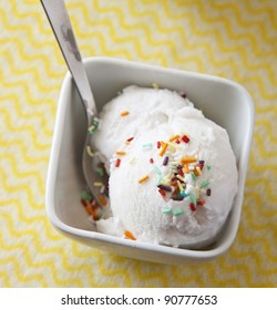 Scoops Of Vanilla Ice Cream In Bowl With Sprinkles