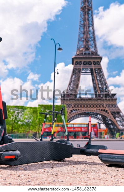 Scooter on the street of\
Paris. Car rental. Youth trends and fashion technology. The Eiffel\
Tower