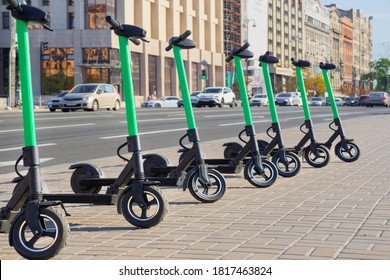 Scooter rental background. Electric scooters for rental . New sharing business project started in city, eco transportation. Vehicle rent service background. Electric kick scooters for transportation