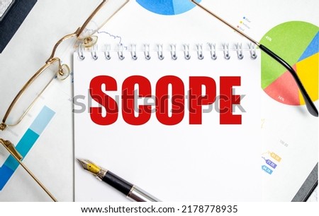 scope word on notepad with glasses and chart