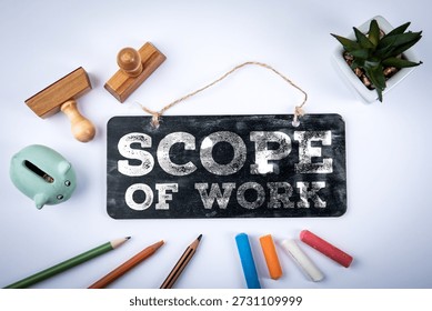 Scope Of Work Statement Displayed On Chalkboard Sign With Office Tools And Planning Elements