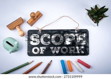 Scope Of Work Statement Displayed On Chalkboard Sign With Office Tools And Planning Elements