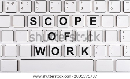 SCOPE OF WORK text on background keyboard. Business