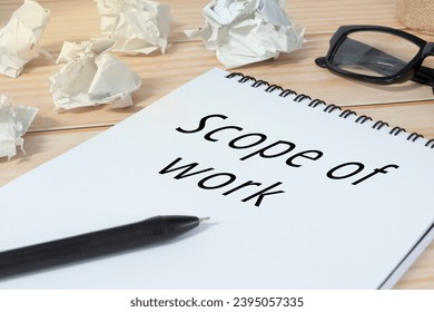 Scope of work written on notepad with trash paper background on office desk. - Shutterstock ID 2395057335