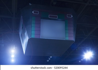 Scoreboard And Spotlights In A Basketball Arena