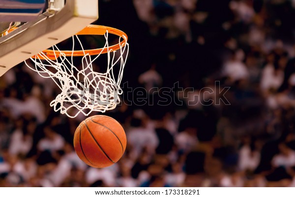 Scoring the\
winning points at a basketball\
game
