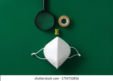 Scotch Tape, Magnifying Glass And Protective Face Mask On Green Background. Back To School Concept