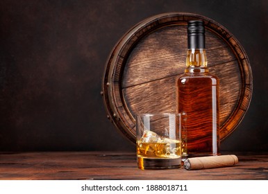 Scotch Whiskey Bottle, Glass, Cigar And Old Wooden Barrel. With Copy Space