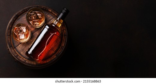 Scotch Whiskey Bottle, Glass And Old Wooden Barrel. With Copy Space. Top View Flat Lay