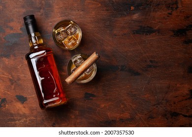 Scotch Whiskey Bottle, Glasses And Cigar. With Copy Space. Top View Flat Lay