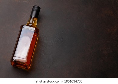 Scotch Whiskey Bottle On Stone Table. With Copy Space. Top View