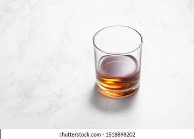 Scotch Whiskey In Glass On A White Mable Table With A Blank Space For A Text, Scotch Whiskey In Bar Background