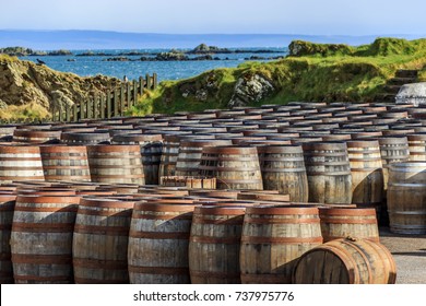 Scotch Whisky Barrels Lined Up Seaside On The Island Of Islay, Scotland UK 